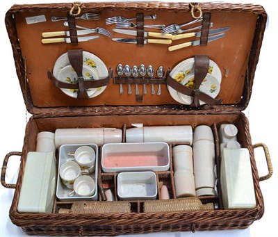 Lot 1080 - A 1950/60s Brexton 7997 Picnic Set, comprising a china tea service, cutlery, flasks and storage...