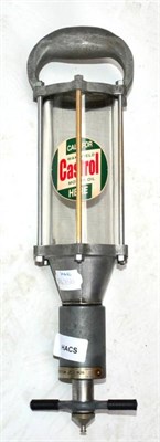 Lot 1149 - A Castrol Non-Drip Dispenser, with moulded hand/suspending grip and glass bottle with adhesive...
