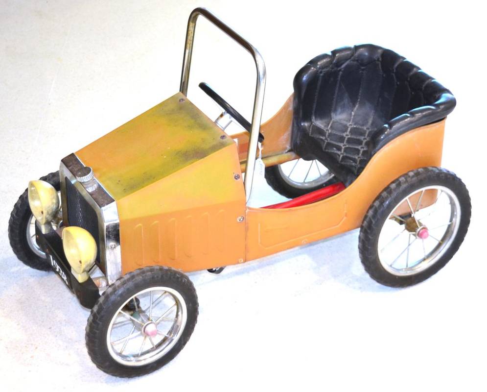 Lot 1216 - A 1930s Style Metal and Chrome Child's Pedal Car, modern, with a four-spoke steering wheel and...