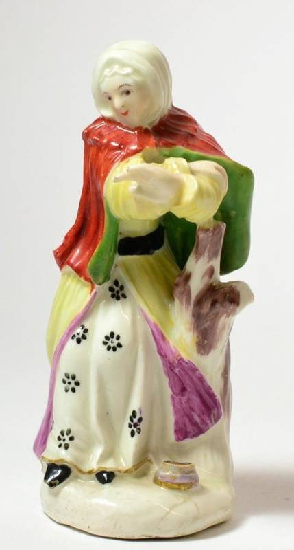 Lot 8 - A Derby Porcelain Figure of Winter, circa 1765, from a set of The Seasons, as a lady holding...