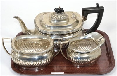 Lot 3 - A silver three piece tea service, Alexander Clark, Birmingham 1935, part fluted with egg and...
