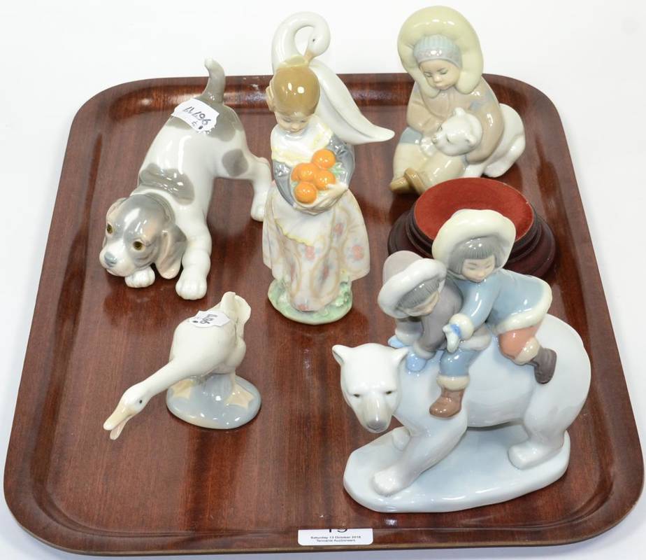 Lot 19 - Six Lladro china figures including Valencia girl, eskimos and various animals