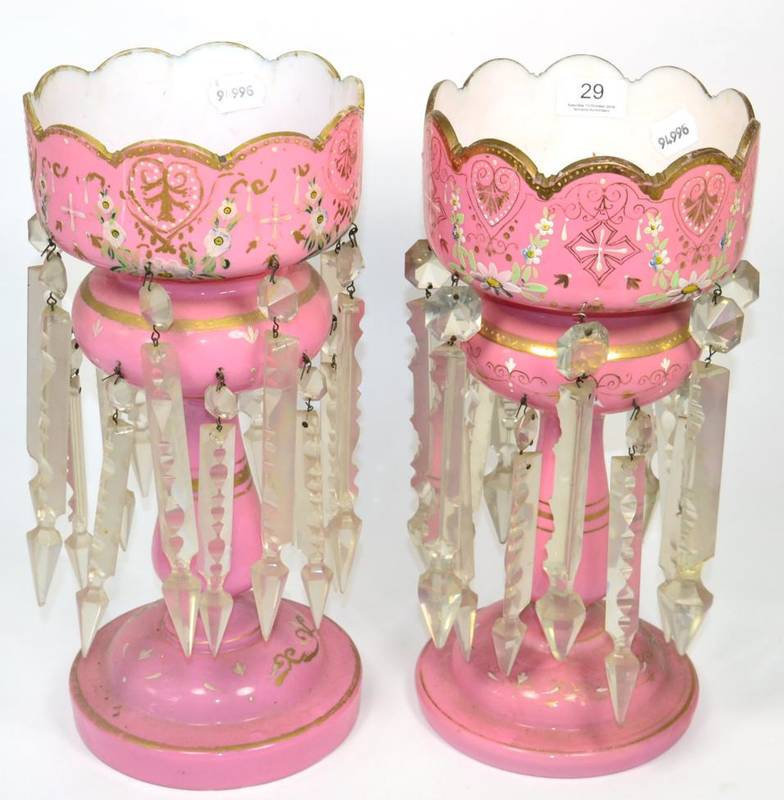 Lot 29 - A near pair of pink opaque glass candlestick lustres, 36cm high