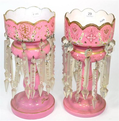 Lot 29 - A near pair of pink opaque glass candlestick lustres, 36cm high