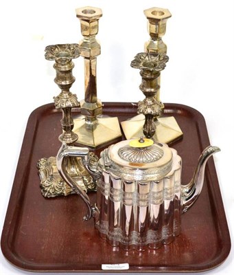 Lot 34 - A silver candlestick of 18th century style, Goldmsiths & Silversmiths; a plated example to match; a