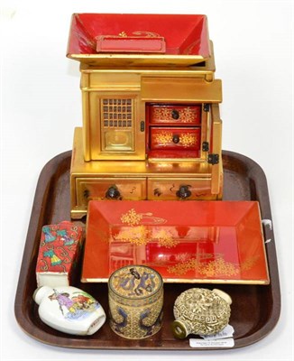 Lot 41 - A Japanese lacquered cabinet together with three scent bottles and a cloisonne box