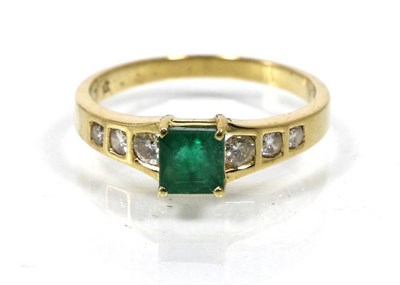 Lot 71 - An emerald and diamond ring, a square octagonal emerald in a claw setting, to diamond set...