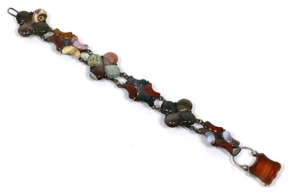 Lot 72 - A Scottish hardstone bracelet, of alternating links each set with various hardstones, to an...