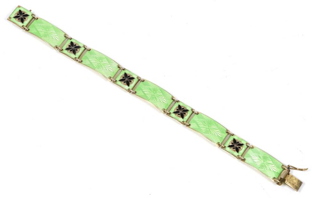 Lot 94 - A Norwegian enamel bracelet, by Norne, of rectangular green guilloche enamel links spaced by...