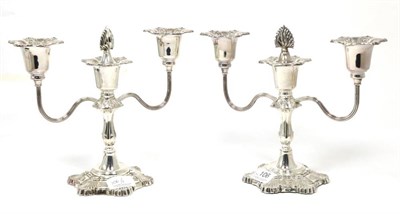 Lot 106 - Pair of silver three light candelabra, Hampton Utilities, Birmingham 1970/72, with reeded branches
