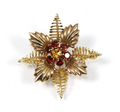 Lot 135 - A 9 carat gold spray brooch, by Alabaster & Wilson, a central round cut citrine within a cluster of