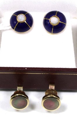 Lot 137 - A pair of blue enamel and opal earrings, a round cabochon opal within a blue guilloche enamel...