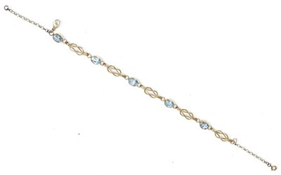 Lot 143 - 9 carat gold blue topaz bracelet, oval cut blue topaz in rubbed over settings, spaced by knot...