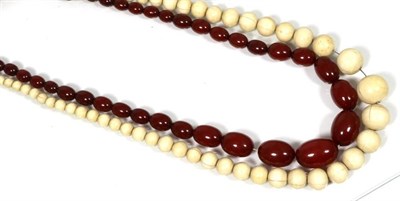 Lot 149 - A graduated oval red bead necklace