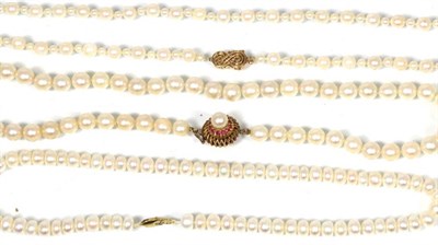 Lot 159 - A cultured pearl necklace with a ruby set clasp, length 45cm, a cultured pearl necklace with a...