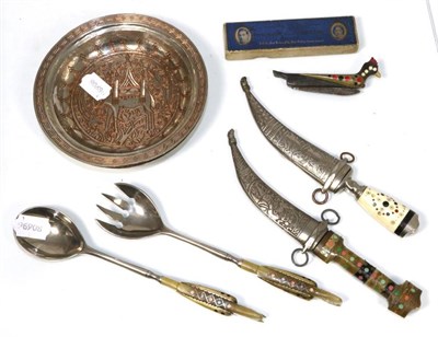 Lot 163 - A pair of Damascus white metal dishes, dated 1945; together with two daggers and sheath's; a...