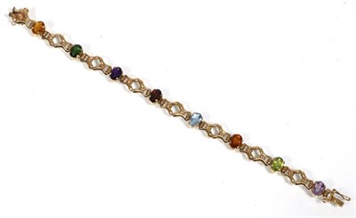 Lot 165 - A 9 carat gold gem set bracelet, oval cut citrine, amethyst, garnet, topaz and peridot spaced...