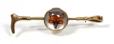 Lot 173 - An Essex crystal fox and riding crop brooch, painted depicting a fox head, on a mother-of-pearl...
