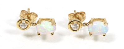Lot 174 - A pair of opal and diamond earrings, total estimated diamond weight 0.10 carat approximately,...
