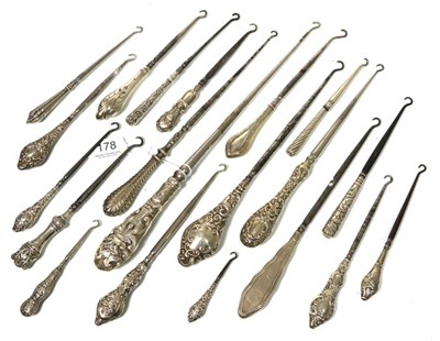 Lot 178 - A collection of nineteen silver handled button hooks; and a plated example