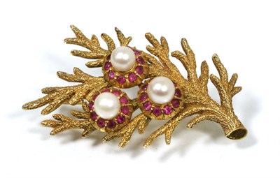Lot 196 - A cultured pearl and ruby floral brooch, three cultured pearls within ruby petal borders, to...