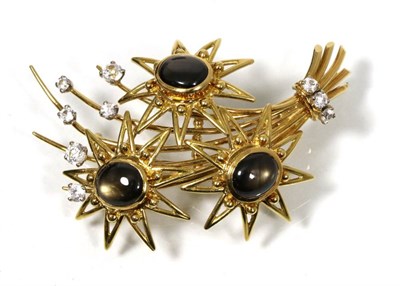 Lot 201 - A black star sapphire and cubic zirconia spray brooch, as star sapphire set flower heads, to...