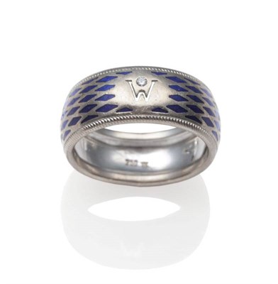 Lot 179 - A Diamond and Blue Enamel Band Ring, by Wellendorff, inset with a round brilliant cut diamond above