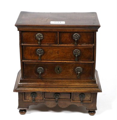 Lot 231 - A miniature or apprentice chest on stand, with drop handles, on bun feet