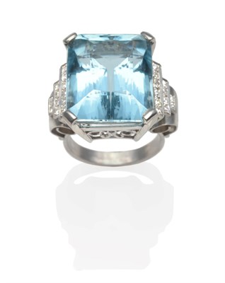 Lot 193 - An Art Deco Aquamarine and Diamond Ring, an emerald-cut aquamarine in a white claw setting and...