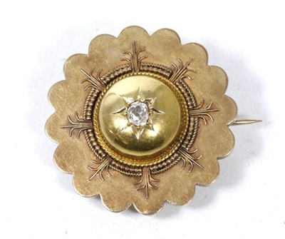 Lot 244 - A Victorian diamond target brooch/pendant, star set with a central old cut diamond, estimated...