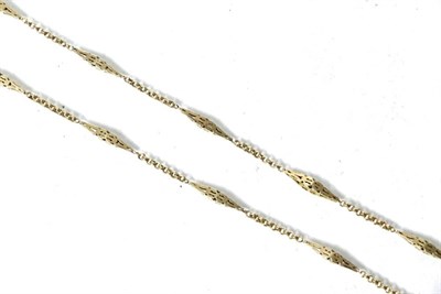 Lot 245 - A fancy link guard chain, of pierced lozenge-shaped and double curb links, with clip, length 133cm