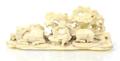 Lot 251 - A Chinese carved ivory 'Goat Herd' brush rest, Qing Dynasty, carved to depict a figure between...