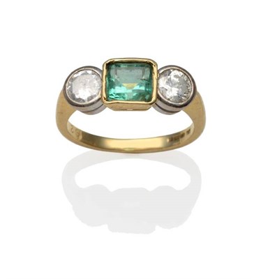 Lot 210 - An 18 Carat Gold Emerald and Diamond Three Stone Ring, an emerald-cut emerald in a yellow...