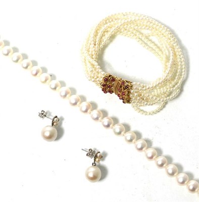 Lot 260 - An Akoya cultured pearl necklace with a Chinese character clasp, length 43cm, a pair of...