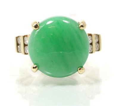 Lot 271 - A jade and diamond ring, a round cabochon jade to diamond set shoulders, total estimated...