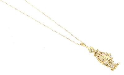 Lot 273 - A 9 carat gold gem-set articulated clown pendant, on a 9 carat gold chain, 15.5g