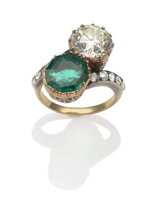 Lot 213 - An Emerald and Diamond Two Stone Twist Ring, an octagonal step cut emerald and an old brilliant cut