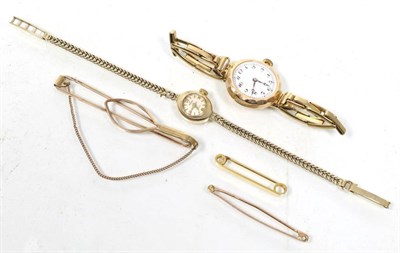 Lot 287 - A gold cased wristwatch, a 9 carat gold cased Majex wrist watch, on a bracelet strap (a.f.), a clip