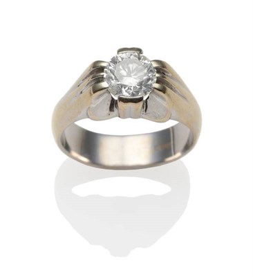 Lot 237 - A Diamond Solitaire Ring, a round brilliant cut diamond in a white claw setting, to grooved...