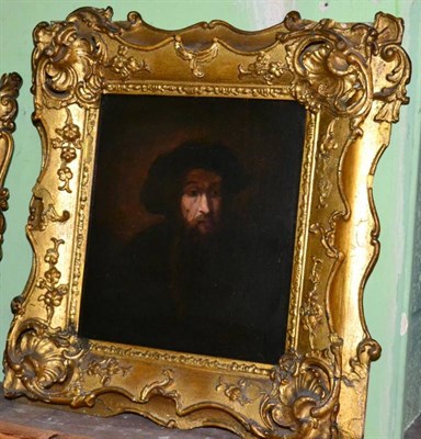Lot 1066 - After Rembrandt van Rijn, Portrait of a bearded man in a cap, oil on board, 24cm by 21cm