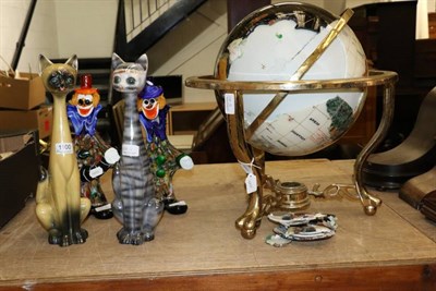 Lot 1100 - A modern inlaid globe on stand (a.f.); together with two Murano clowns and a pair of Dutch...