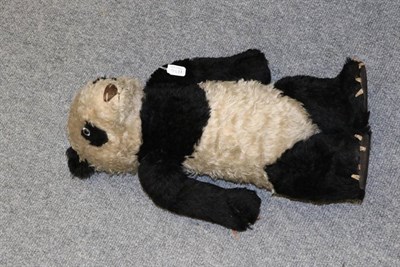 Lot 1134 - Circa 1930s Merrythought panda, with brown stitched nose, jointed arms, four claws to all four...