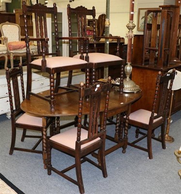 Lot 1151 - An oak gateleg table and a set of six dining chairs