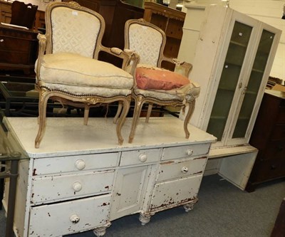 Lot 1156 - A white painted dresser base together with a glazed cabinet on associated stand