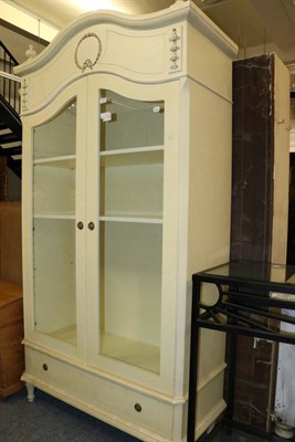 Lot 1160 - A cream painted cupboard