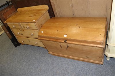 Lot 1161 - A pine three height chest of drawers and a pine domed trunk