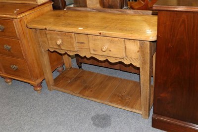 Lot 1166 - A pine hall table, with two drawers and a shelf