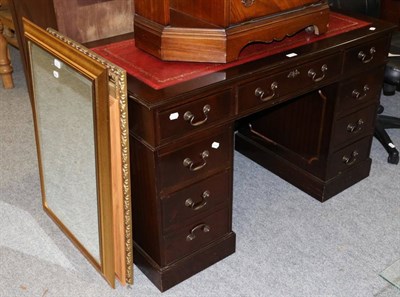 Lot 1169 - A reproduction twin pedestal desk with leather inset top