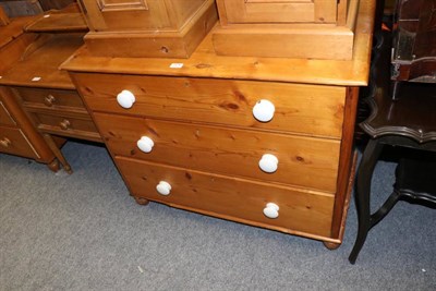 Lot 1176 - A pine three height chest of drawers