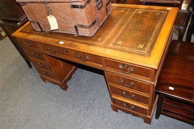 Lot 1185 - A reproduction twin pedestal desk with leather inset top